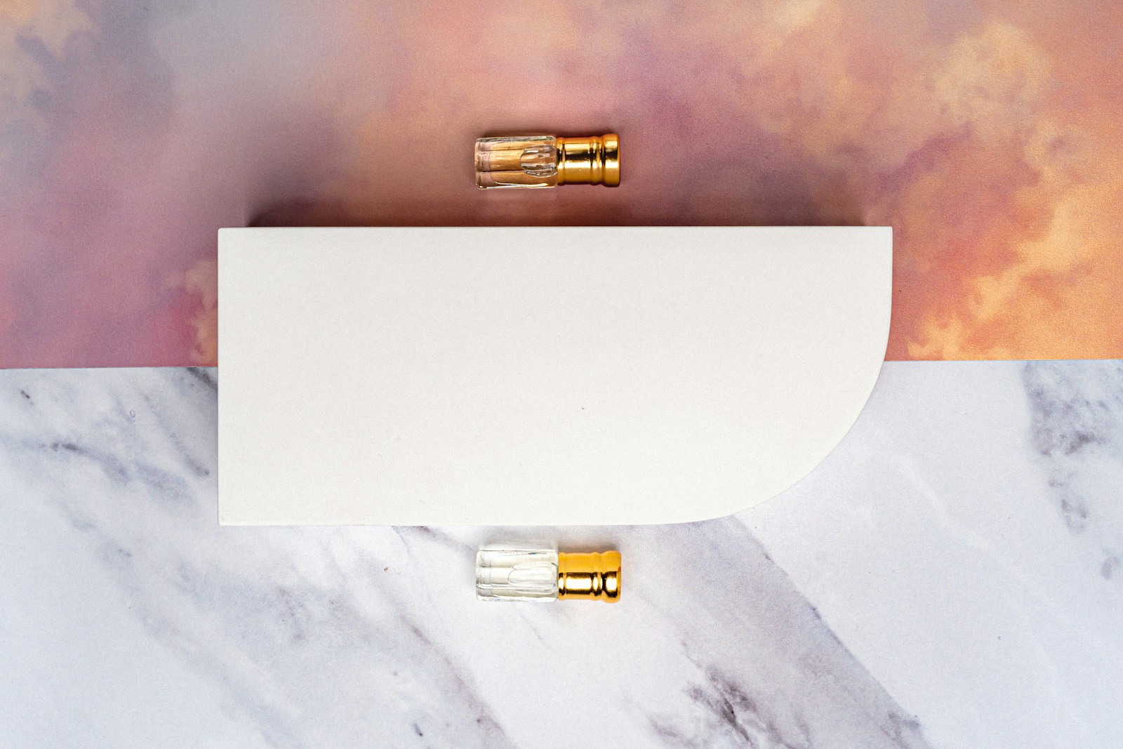 a pair of gold bullet plugs sitting on top of a white piece of paper